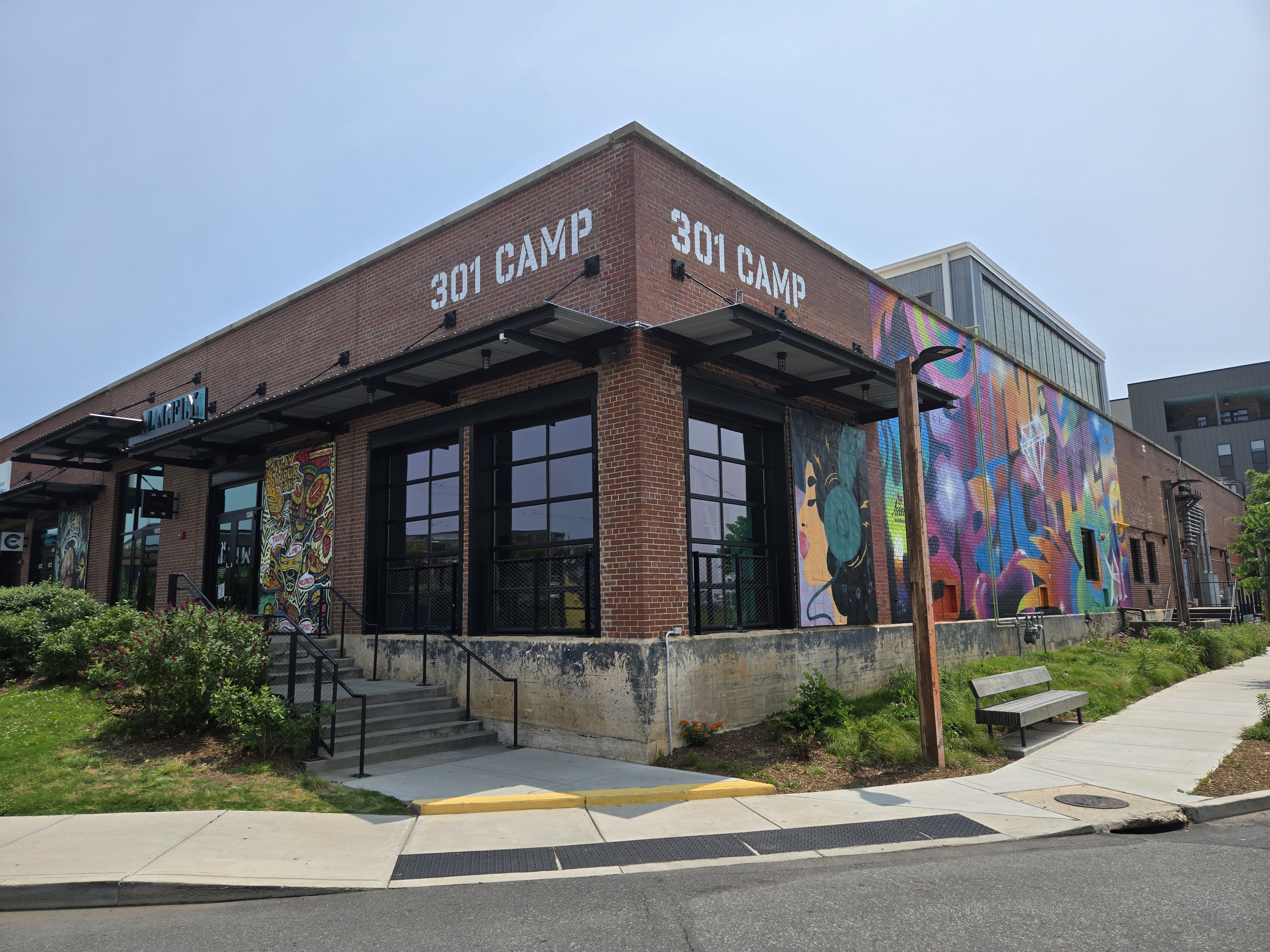 Public artwork on the brick exterior of 301 Camp Road